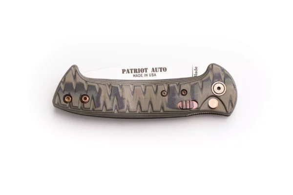 Closed Patriot Auto knife with OD black G10 handle and visible button lock
