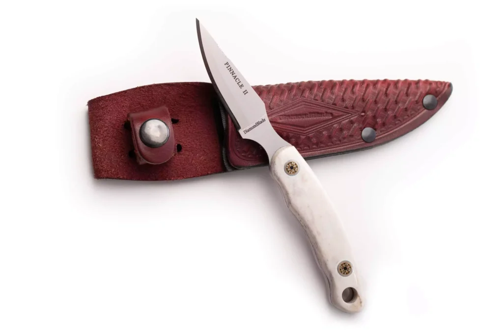 Pinnacle II knife with stag handle shown alongside a DiamondBlade leather sheath