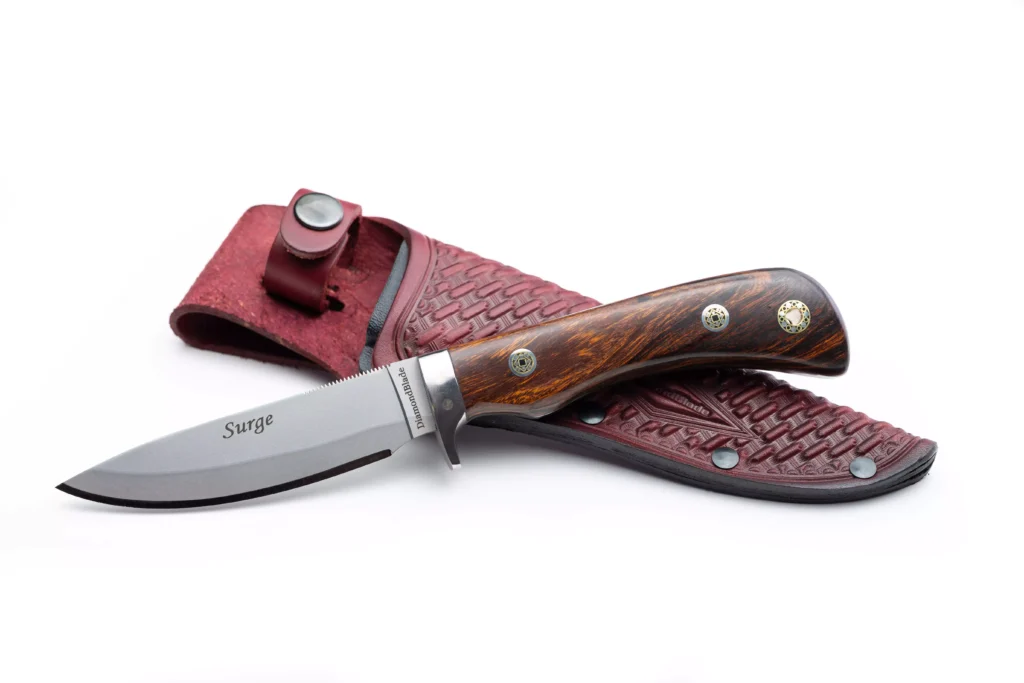 DiamondBlade Surge knife with ironwood handle resting on leather sheath