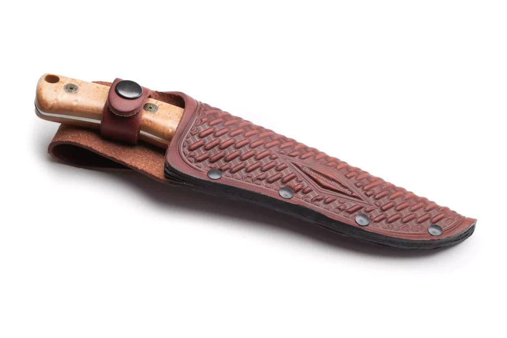 DiamondBlade fixed-blade knife with burlwood handle secured in a tooled leather sheath