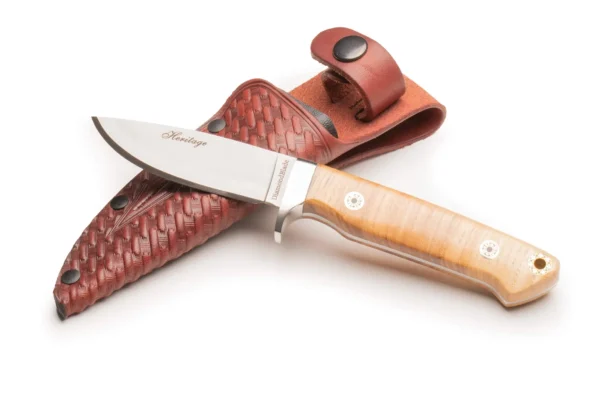 Heritage Ash Model knife with G10 stag-style ash handle and D2 Friction Forged blade displayed beside custom leather sheath